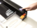 PowerTrim™ Electric Paper Rotary Trimmer__Powertrim 5413001 button.png